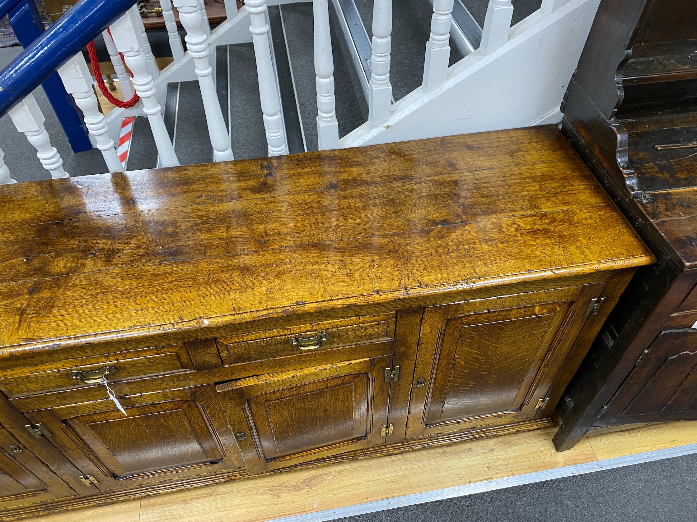 An 18th century style pale oak low dresser, length 190cm, depth 49cm, height 83cm